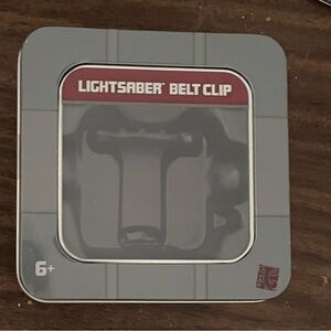 New in Box Disney Star Wars Galaxy’s Edge Savi’s Workshop lightsaber belt clip